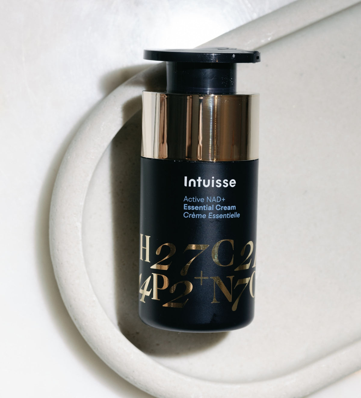 Intuisse Active NAD+ Peptide Essential Cream applicator photographed from above