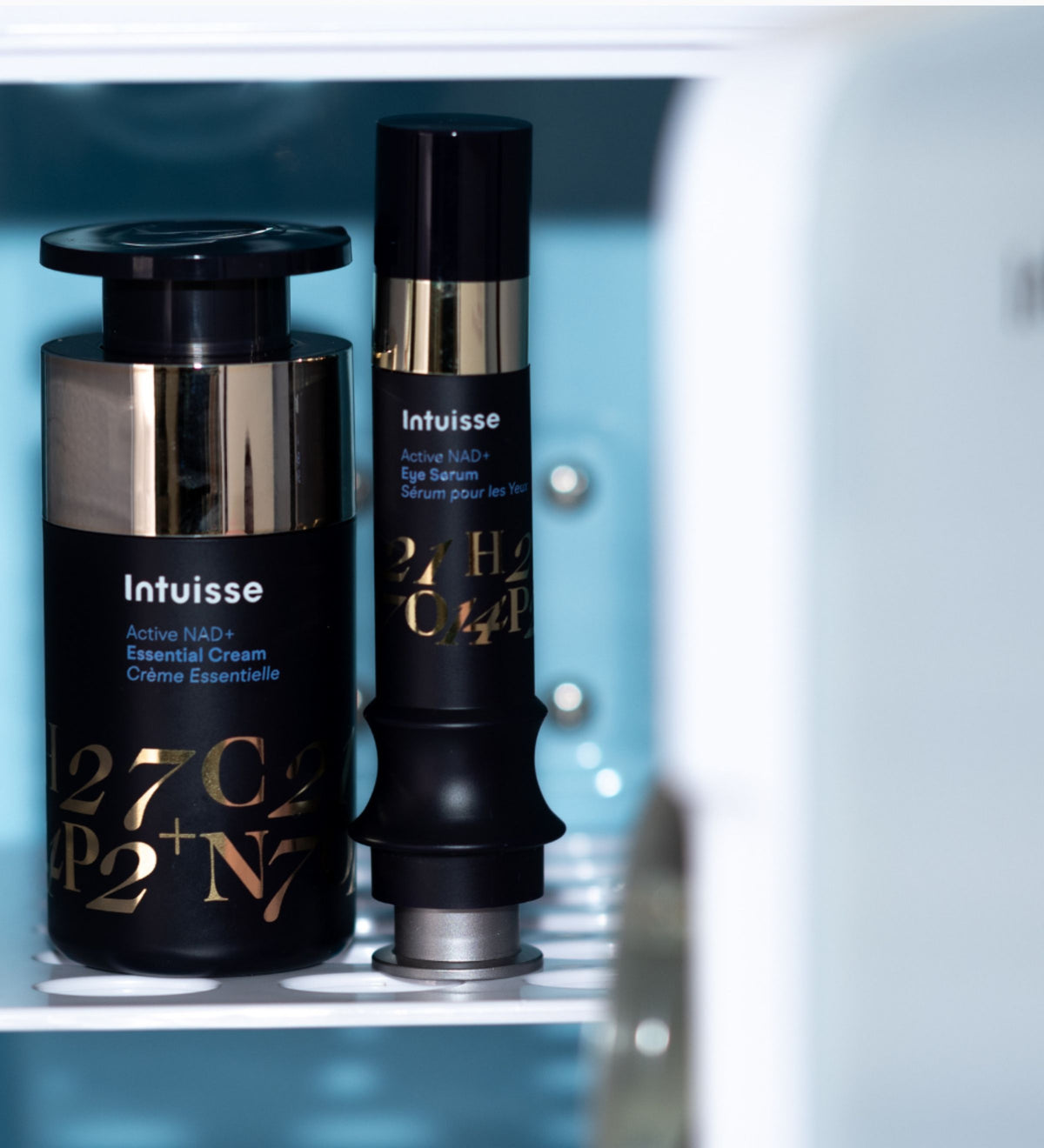 Inside the Intuisse skincare fridge: Active NAD+ Essential Cream and Eye Serum on the shelf