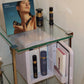 Intuisse skincare fridge displayed on a glass shelf with the Active NAD+ range a intuisse leaflet